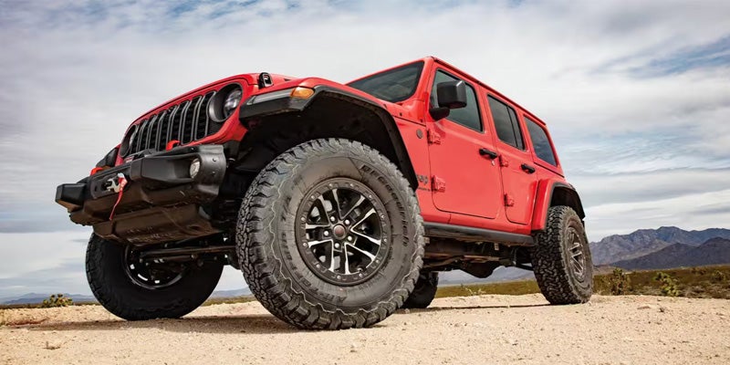 Red Jeep Wrangler off-road stance