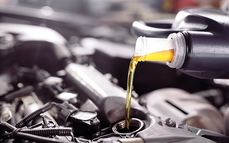 service technician performing an oil change